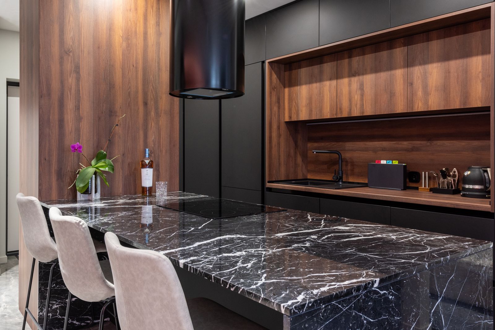 Black induction cooktop surface in a contemporary kitchen — Fisher & Paykel cooktop repair