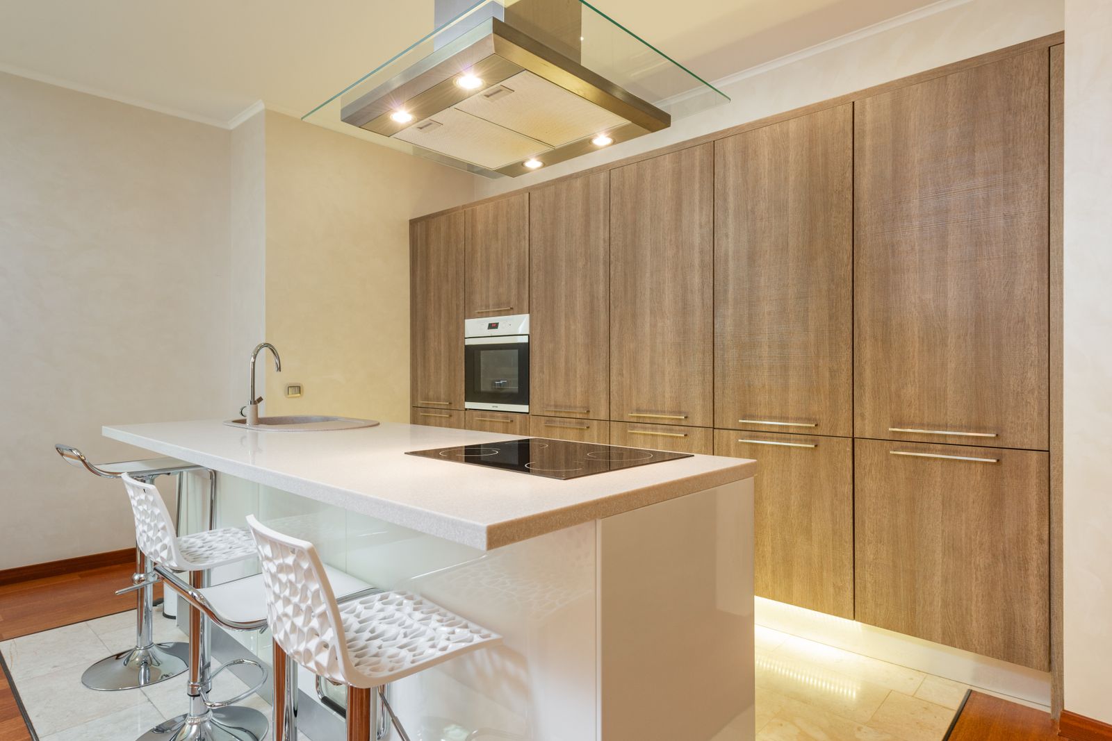 A flush-mount cooktop integrated into a kitchen island — Fisher & Paykel cooktop repair