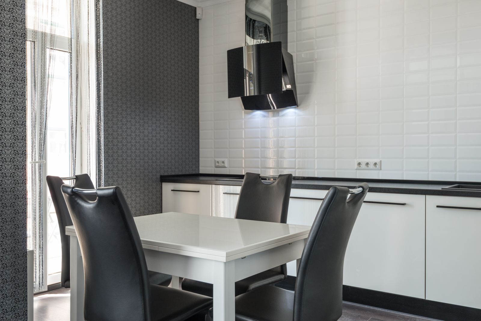 A contemporary kitchen with induction cooktop and wall oven — Fisher & Paykel appliance repair