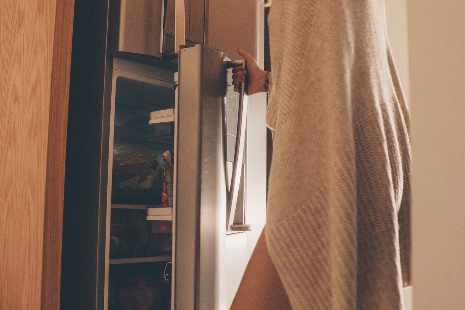 A French-door refrigerator integrated into a modern kitchen — Fisher & Paykel refrigerator repair