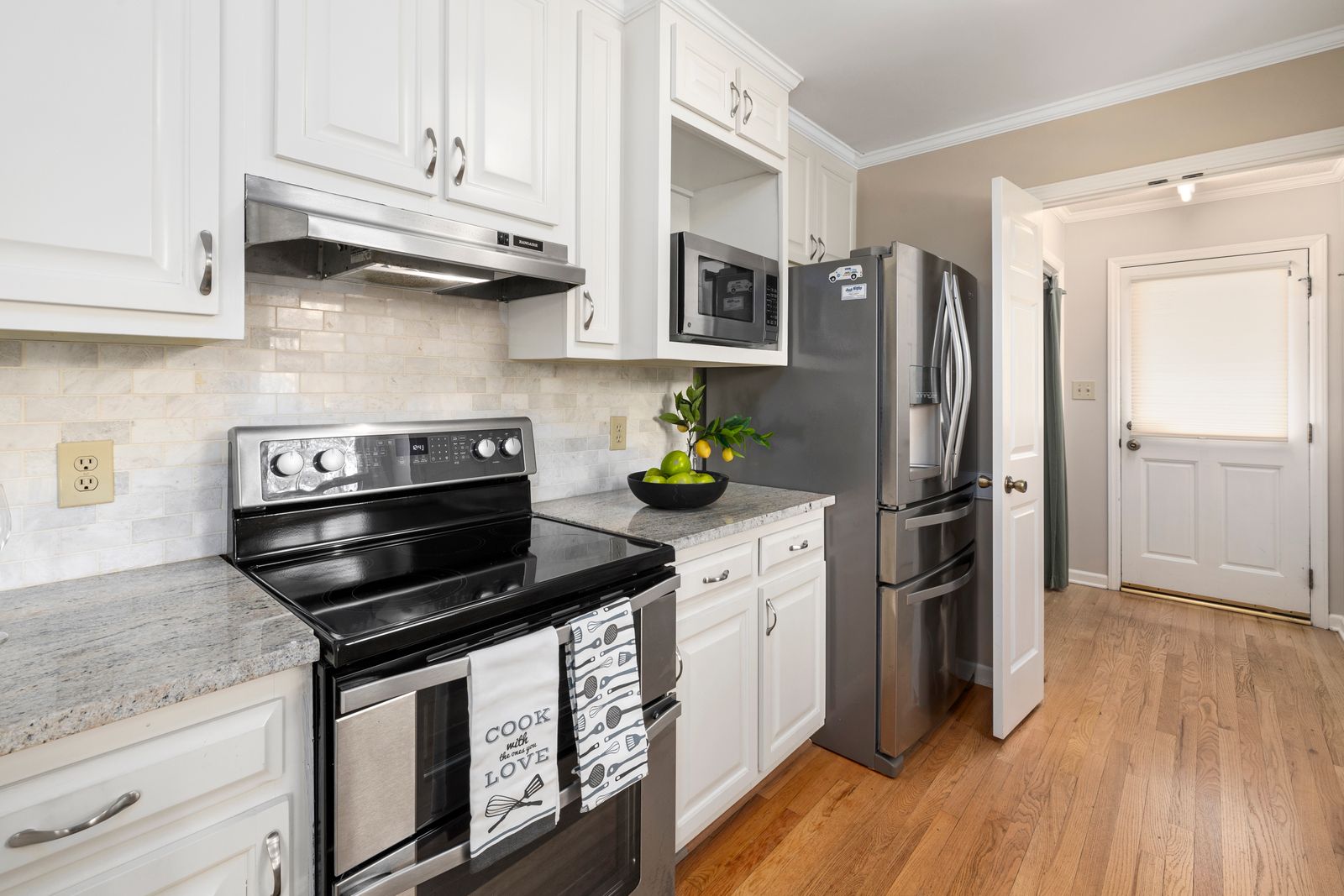 A stainless refrigerator in a spacious open-plan kitchen — Fisher & Paykel refrigerator repair
